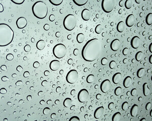 Water drops bead on a window after a hard rain