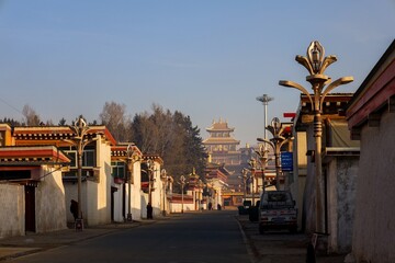 Traditional Tibetan architecture lines the street leading to Kirti Monastery in Ngawa, a historic...