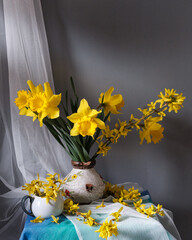 A stunning display of vibrant yellow flowers beautifully arranged in a vintage pitcher