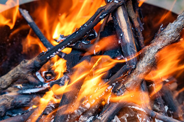 Fireplace burning wood logs, glowing embers, cozy warmth, relaxing atmosphere
