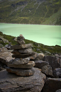 Rocks arranged in a Zen style on a rock usually signify a form of meditation and striving for inner balance. Such compositions, inspired by Japanese Zen gardens, are supposed to promote calm and conce