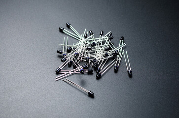 Black infrared photodiodes arranged on dark background for electronics use