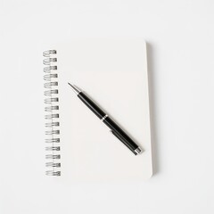A pen rests on the open pages of a spiral notebook, symbolizing writing and creativity
