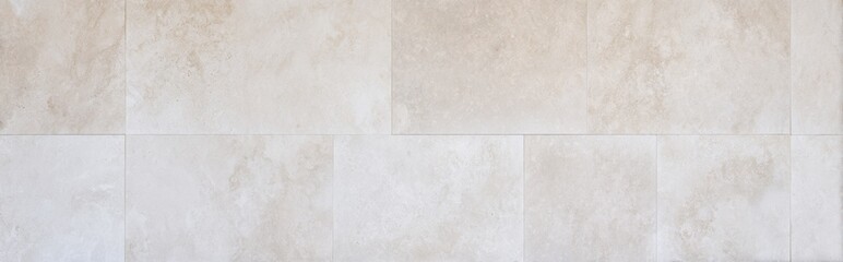 Smooth travertine tile background in top-down flat offset tile structure