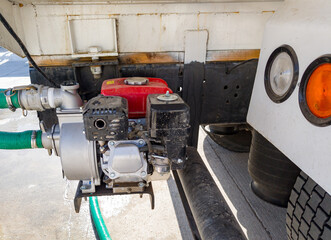 Fuel pump on the back of a tanker truck for pumping water
