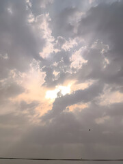 Stunning Sunrise: Heavenly Light Breaking Through Clouds