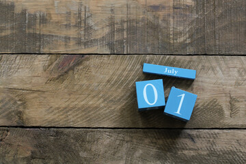 Canada day, july 1st celebrated with blue wooden calendar on rustic background