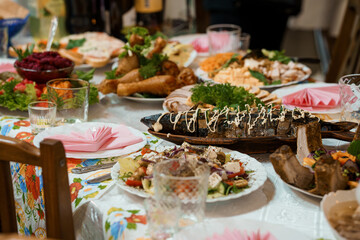 Lavishly Set Traditional Feast Table: Abundant Ukrainian Cuisine, Colorful Dishes, Festive Dinner, Family Gathering, Dark Wood, Vibrant Textiles.
