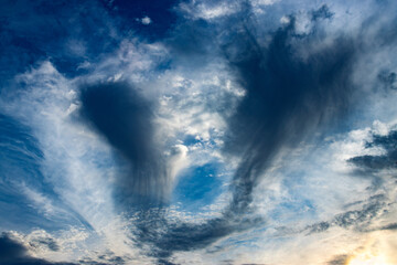 storm clouds in blue sky at sunset
