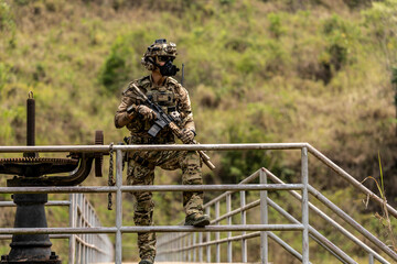 Special Forces Unit Conducting Tactical Patrol on Bridge – Armed Soldiers with Rifles and Full...