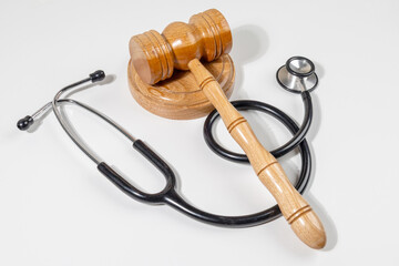 Legal Accountability in Healthcare – Gavel and Stethoscope On White Surface
