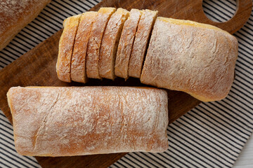 Homemade Ciabatta Bread on a wooden board, top view. Flat lay, overhead, from above.