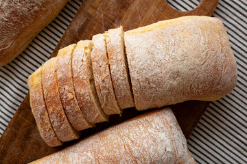 Homemade Ciabatta Bread on a wooden board, top view. Flat lay, overhead, from above.
