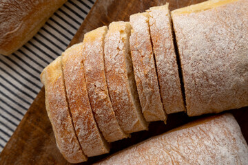 Homemade Ciabatta Bread on a wooden board, top view. Flat lay, overhead, from above.
