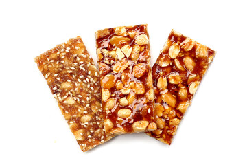 Crispy peanut brittle bars coated in glossy caramel.