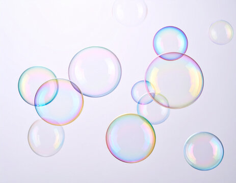 Iridescent soap bubbles floating against a soft, light background, creating a whimsical and ethereal atmosphere
