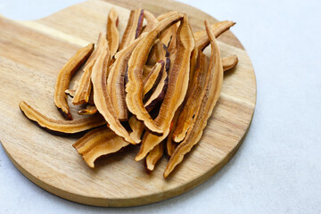 Fototapeta premium Dried slices of Ganoderma lucidum, also known as reishi mushroom, widely used in traditional medicine for its immune-boosting properties.