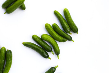 Mini cucumbers on white background.