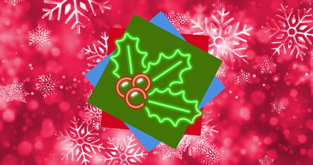 Neon holly leaves and berries sitting on holiday design with green red blue squares and snowflakes