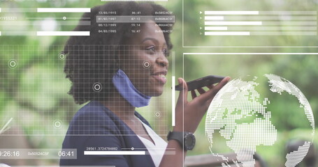 Talking businesswoman wearing blazer mask speaking into smartphone at park bench, with data overlay