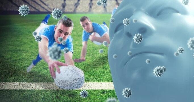 Diving rugby players in blue reaching for ball on stadium field, with head sculpture, virus models