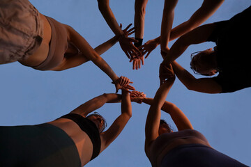 under view friendship People partnership teamwork crossed hands finishing up meeting show unity on...
