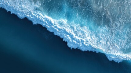 Ocean wave crashes dramatically from aerial perspective. Marine environment, sea foam, oceanography, splash, surge, aquamarine