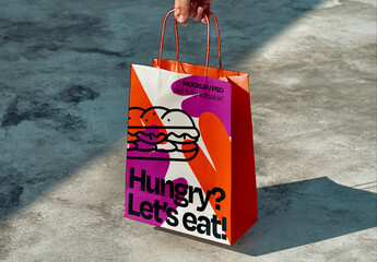 Food Delivery Paper Bag Mockup Held by Hand