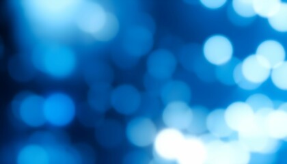 Abstract bokeh background of blurred blue and white lights.