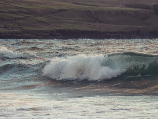 Powerful ocean waves and pastel sky. Nature scene with water and clouds. Nobody. Rough power and energy concept.