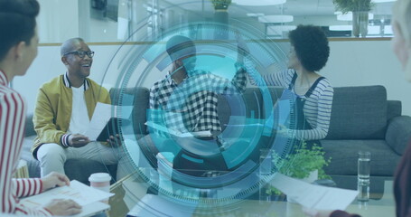 Team of five in office attire reviewing reports in office lounge, with analytics overlay and coffee