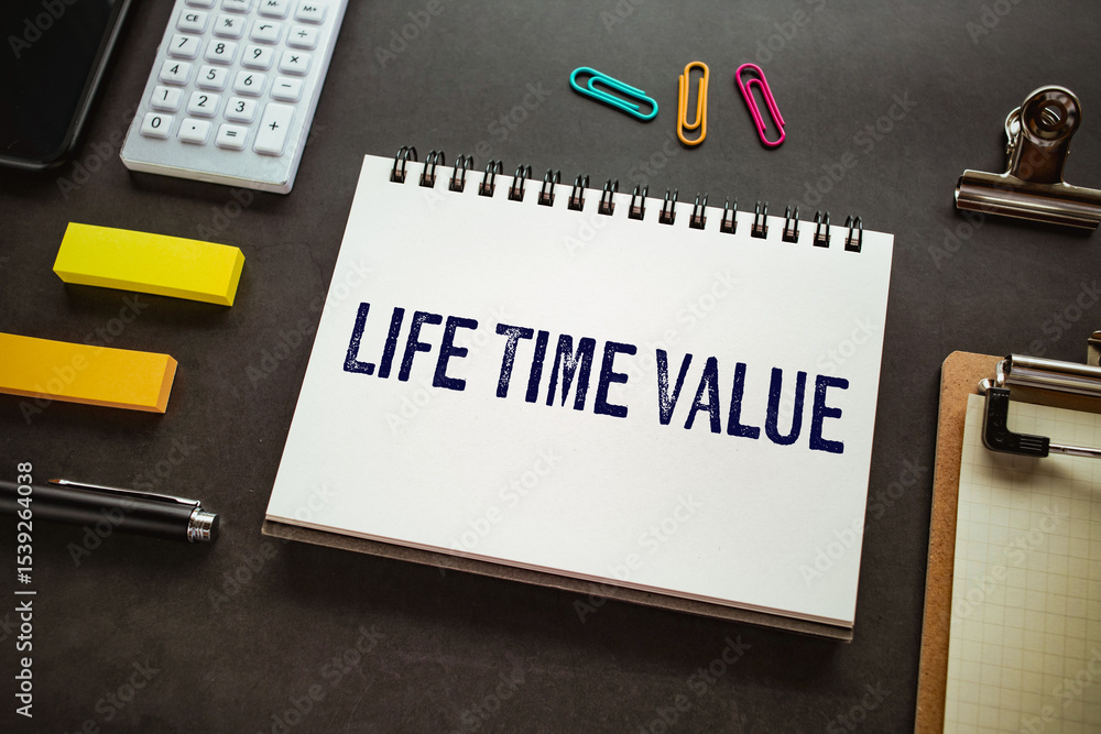 Poster there is notebook with the word life time value. it is as an eye-catching image.