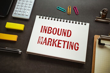 There is notebook with the word Inbound Marketing. It is as an eye-catching image.