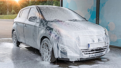 Car washing. Car cleaning soap foam. Spray bubbles pressure wet shine.