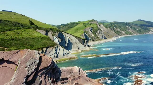Breathtaking aerial views of zumaia's flysch coastline, showcasing its unique geological formations and vibrant turquoise waters