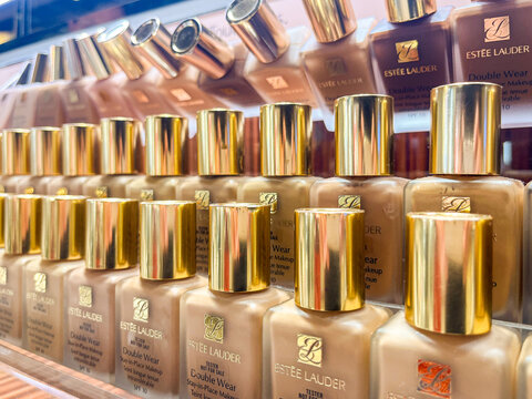 Alicante, Spain - May 23, 2025: Estee Lauder foundation bottles lined up on display, showcasing various shades and luxurious packaging, perfect for beauty enthusiasts and makeup lovers