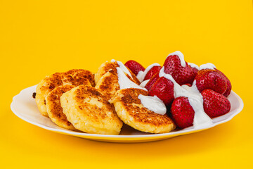 Delicious breakfast plate with pancakes and strawberries