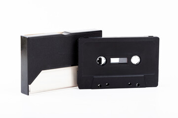 Blank black audio cassette tape and empty plastic case isolated on white background cut out, copy space template mockup Vintage retro music media storage closeup old analog media sound music tracks
