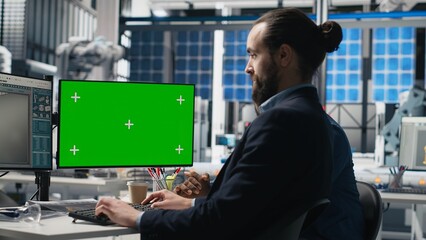 Solar panels inspection group review data on pc next to green screen, finding errors during a...