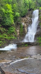 The magnificent Jean-Larose Falls flowing into their sedimentary rock cliff.
