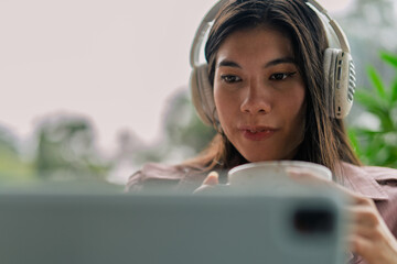 Freelancer working remotely from coffee shop enjoying a cup of coffee