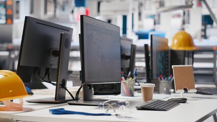 Computer display in solar panels manufacturing plant used to study solar energy systems. PC screen on desk in empty photovoltaics factory used to improve efficiency, sustainable solutions.
