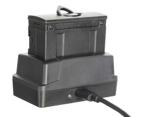 Battery for a night vision riflescope being recharged