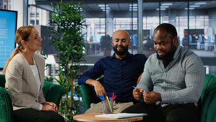 African american leader giving his signature and consent after important meeting, marking the start on a fruitful partnership. Business people with authority reach an agreement. Camera B.