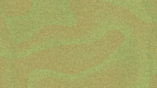 Blotchy speckled pattern of tan and green slightly blurred