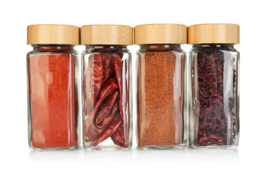 Many different aromatic spices in jars isolated on white