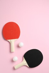 Ping pong rackets and balls on pink background, flat lay. Space for text