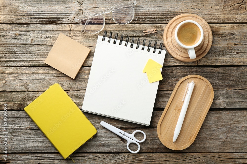 Aufkleber flat lay composition with open blank notebook on wooden table