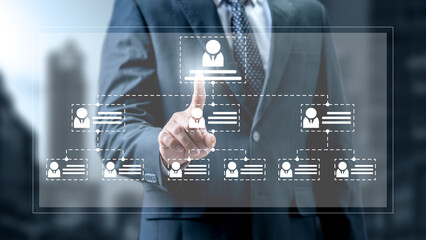 Businessman touching the flowchart icon of a human representing potential candidates. Technology innovation on a virtual screen. Concept of human resources recruitment and hiring