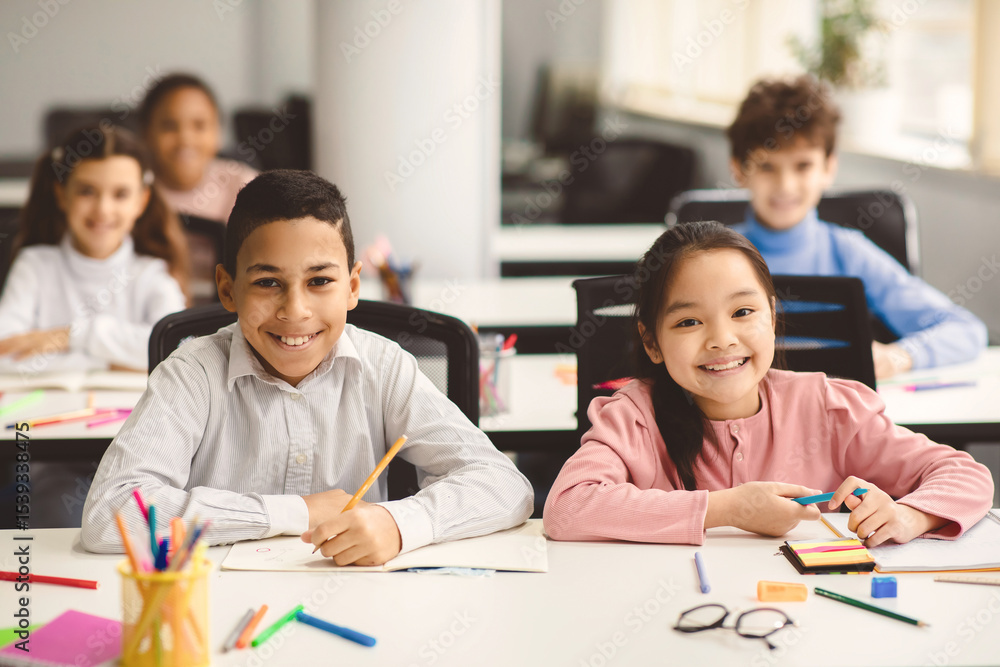 Poster education and children concept. portrait of happy smiling diligent boy and girl sitting at table in 